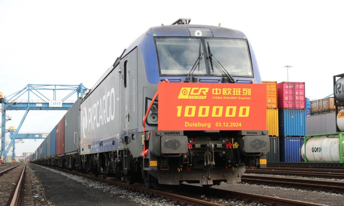 This photo taken on Dec. 3, 2024 shows the 100,000th China-Europe freight train at Duisburg Intermodal Terminal (DIT) in Duisburg, Germany.  (Xinhua/Du Zheyu)