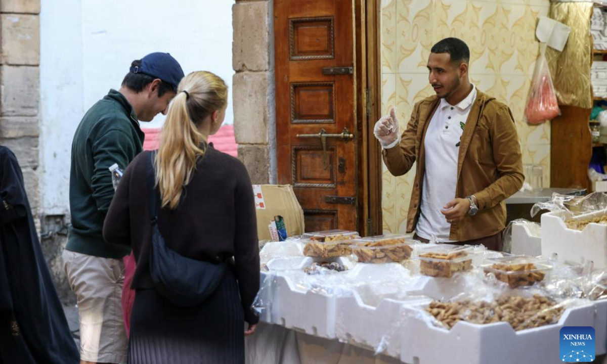 People shop at a sweet shop for the Eid al-Fitr holiday in Rabat, Morocco, March 30, 2025. (Xinhua/Huo Jing)
