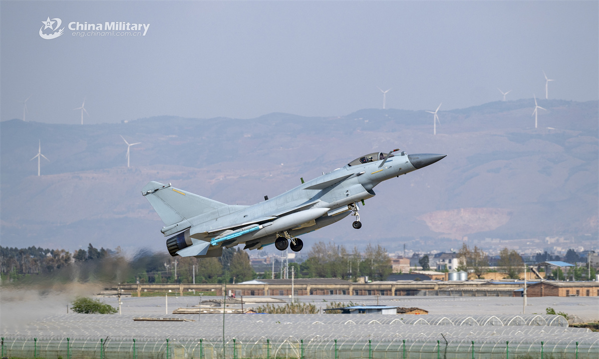 A J-10 fighter jet attached to the Chinese PLA Air Force takes off from the runway and flies to the designated airspace for a round-the-clock flight training exercise aimed at beefing up the pilots' combat capability. (eng.chinamil.com.cn/Photo by Xiao Rui)
