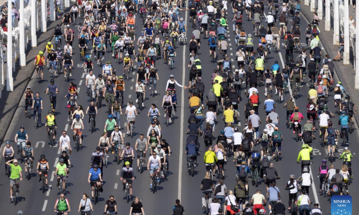 People participate in the I Bike Budapest procession in Budapest, Hungary, on April 26, 2025.
This bike procession is aimed to demonstrate the importance of bicycles as daily city transportation. (Photo by Attila Volgyi/Xinhua)