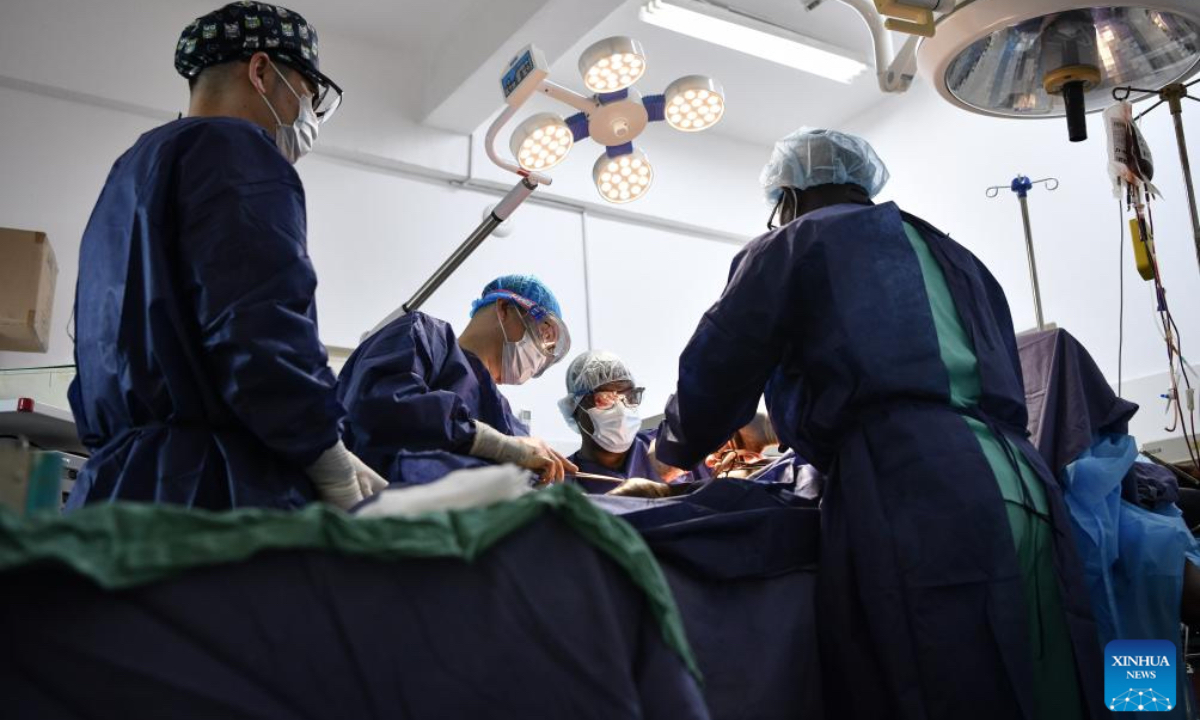 Chinese medical workers Diao Naicheng (2nd L) and Wu Di (1st L) perform surgery on a patient at Sino-Guinean Friendship Hospital in Conakry, Guinea, April 29, 2025. The 31st Chinese medical team dispatched to Guinea arrived in the country in March 2025 and has been providing medical services for local patients and training for local doctors. (Xinhua/Han Xu)