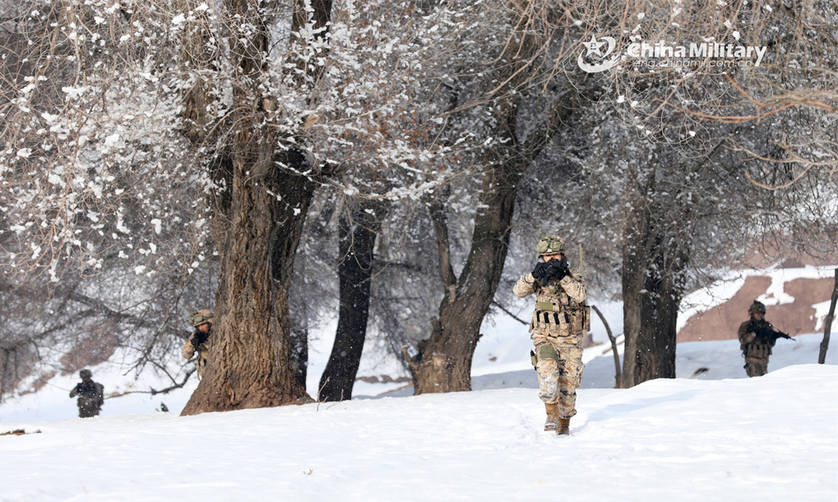 Soldiers assigned to a reconnaissance detachment of a regiment under the Chinese PLA Xinjiang Military Command pass through woods in combat formation during a multi-subject training exercise on February 24, 2025. (Photo: eng.chinamil.com.cn)