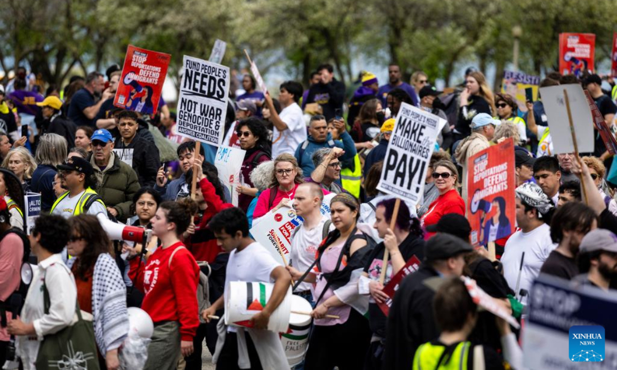 Demonstrators march during a rally at Grant Park in Chicago, the United States, on May 1, 2025. (Photo by Vincent D. Johnson/Xinhua)