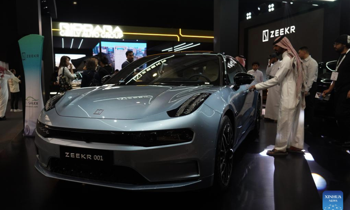 A man views a car from Zeekr during the EVS Saudi Arabia 2025 exhibition in Riyadh, Saudi Arabia, May 4, 2025. The three-day event kicked off here on Sunday, attracting several Chinese brands. (Xinhua/Luo Chen)
