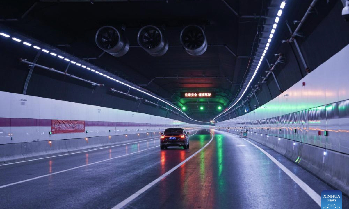 A vehicle runs inside a shield tunnel along the east sixth ring road in Beijing, capital of China, April 20, 2025. A renovation project on Beijing's east sixth ring road was opened to traffic upon full completion on Sunday. The renovated section is about 16.3 kilometers in length, including a 7.4-kilometer-long shield tunnel. The project helps improve expressway transport across the core area of Beijing's sub-center Tongzhou District. (China Railway 14th Bureau Group Co., Ltd./Handout via Xinhua)