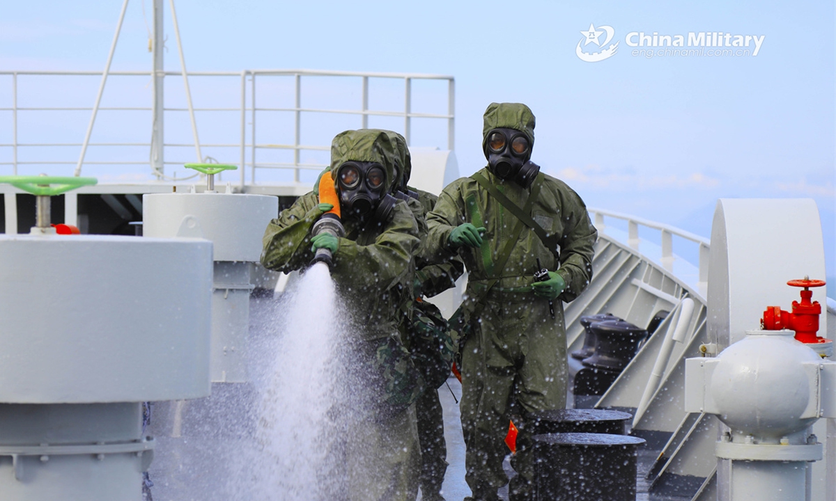 Sailors assigned to a naval service ship group under the Chinese PLA Southern Theater Command conduct decontamination during a maritime combat training exercise in the South China Sea in early March, 2025. (Photo: eng.chinamil.com.cn)