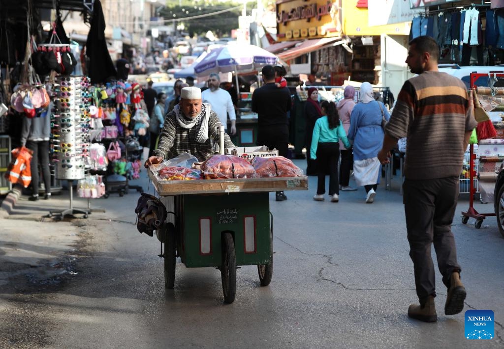 People visit a market ahead of the Eid al-Fitr in the West Bank city of Nablus, on March 26, 2025. (Photo: Xinhua)