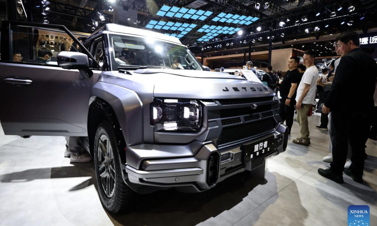 Visitors look at a vehicle of Chinese car brand Jetour at the 21st Shanghai International Automobile Industry Exhibition in east China's Shanghai, April 26, 2025. The exhibition, also known as Auto Shanghai 2025, not only foreshadows technological trends in the global auto market, but also demonstrates the strength and confidence of China's rising automakers in the face of established global giants. (Xinhua/Fang Zhe)