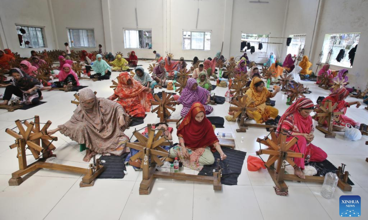 Workers spin cotton into thread to craft traditional muslin garments at a workshop in Narayanganj, Bangladesh, April 19, 2025. (Photo by Habibur Rahman/Xinhua)