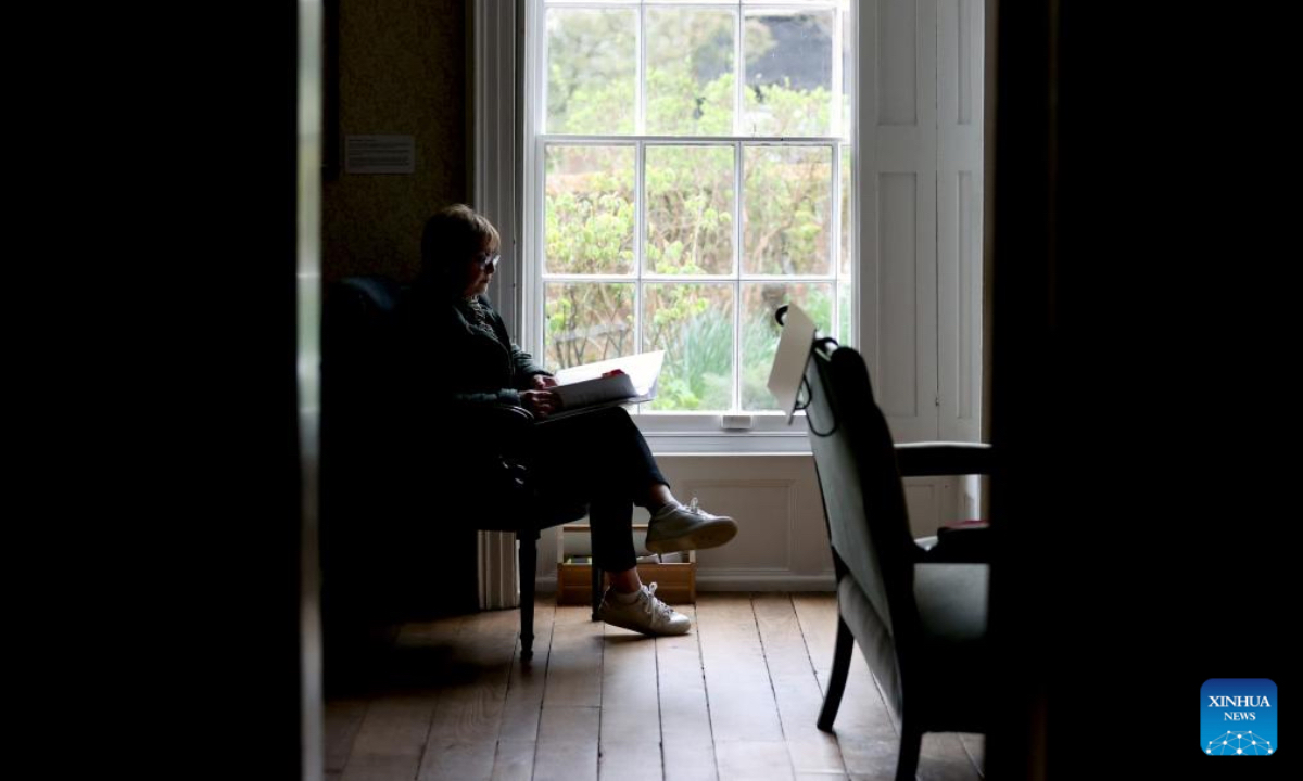 A woman reads at Jane Austen's House in Chawton, Hampshire, Britain, April 18, 2025. As her final home, English female novelist Jane Austen lived in this cottage in Chawton for the last eight years of her life. Here she wrote, revised and published all six of her globally beloved novels: Sense and Sensibility, Pride and Prejudice, Mansfield Park, Emma, Northanger Abbey and Persuasion. (Xinhua)