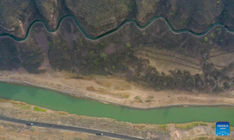 An aerial drone photo taken on March 25, 2025 shows a view of the main canal of the Hongqi Canal in Linzhou City, central China's Henan Province. The Hongqi Canal, an irrigation project built on the steep Taihang Mountains, is dubbed the 