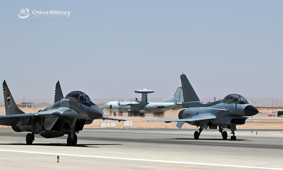A J-10S fighter jet attached to the Chinese People's Liberation Army (PLA) Air Force and an Egyptian MiG-29 fighter jet taxi on the runway during the China-Egypt Eagles of Civilization 2025 joint air force training on April 19, 2025. (eng.chinamil.com.cn/Photo by Yu Hongchun)
