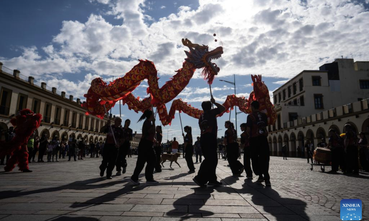 Performers present a dragon dance during the China in Lujan festival in Lujan, Argentina, on May 4, 2025. The festival, featuring typical Chinese music, traditional dance, tasty food and martial arts, was held here on Sunday. (Photo by Martin Zabala/Xinhua)