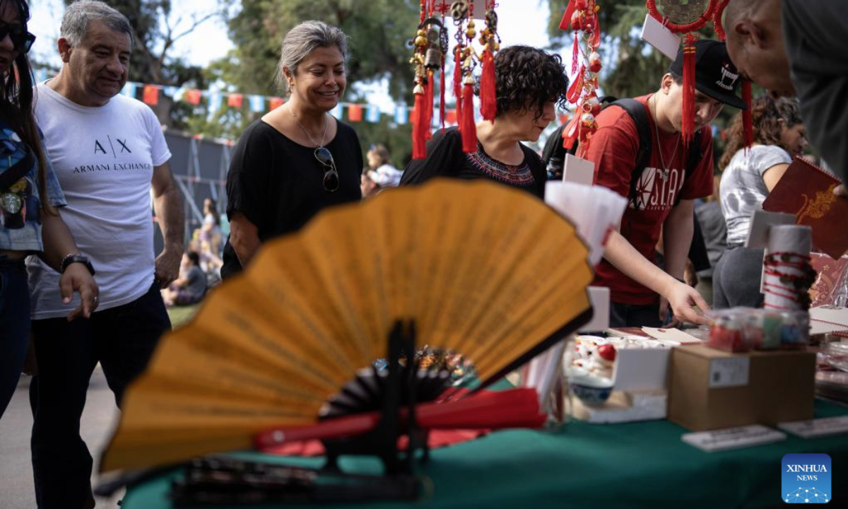 People visit the stands during the China in Lujan festival in Lujan, Argentina, on May 4, 2025. The festival, featuring typical Chinese music, traditional dance, tasty food and martial arts, was held here on Sunday. (Photo by Martin Zabala/Xinhua)