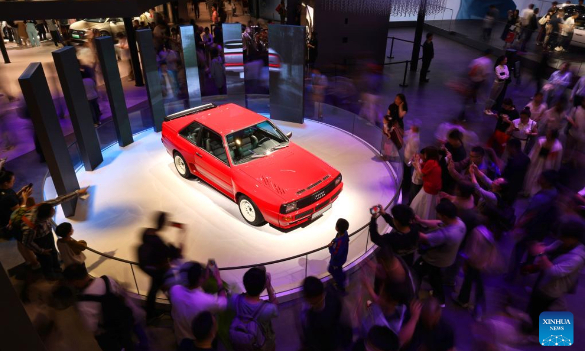 Visitors look at an Audi car on the 21st Shanghai International Automobile Industry Exhibition in east China's Shanghai, May 1, 2025. People visit the auto show here on the first day of the May Day holiday. (Xinhua)