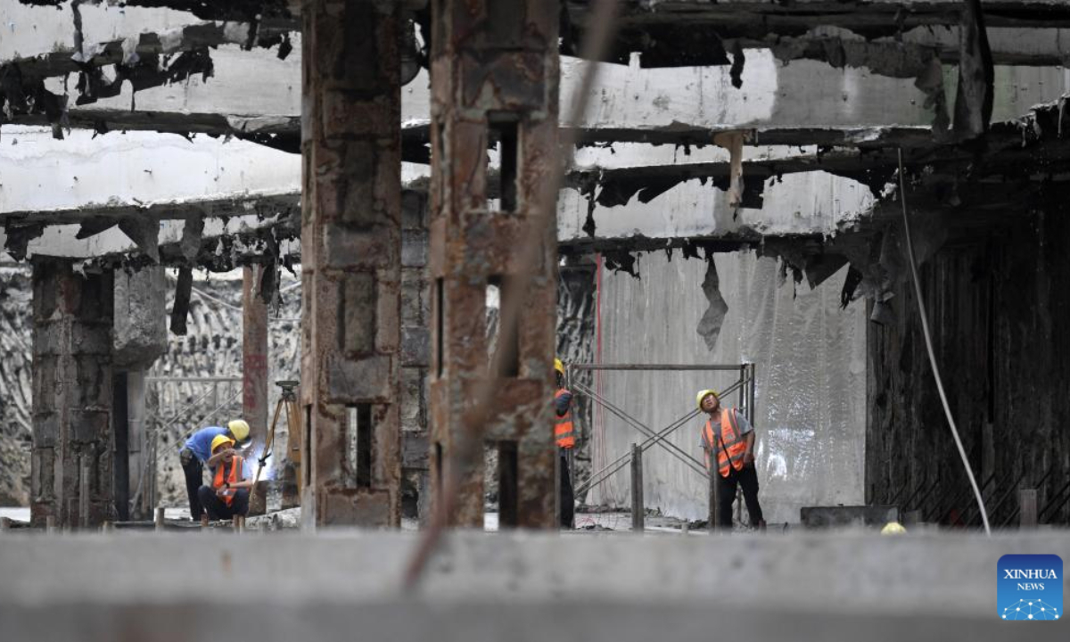 Workers work at the construction site of the Sanya River estuary passage project in Sanya, south China's Hainan Province, May 5, 2025. As the first underwater tunnel in Sanya, the project undertaken by China Railway 20th Bureau Group is making steady progress. It will further optimize the spatial layout of Sanya City once completed. (Xinhua/Zhao Yingquan)