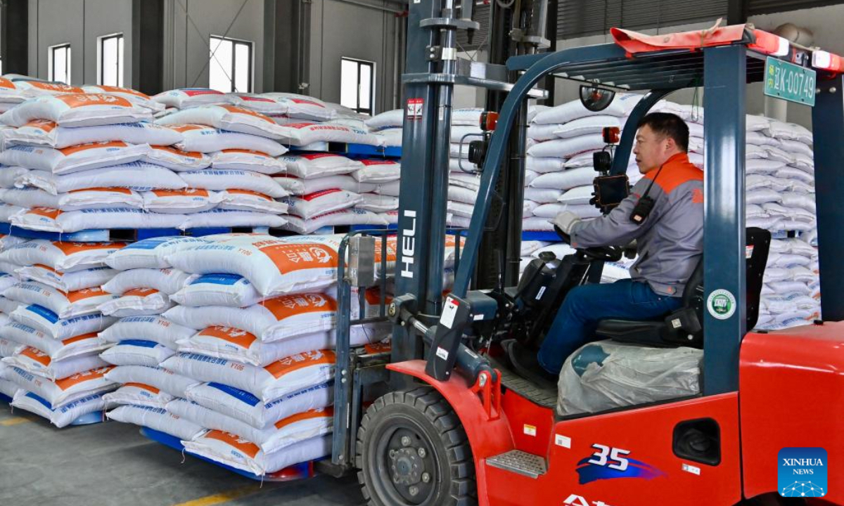 A worker transports bags of feed at a factory in Liaoyang City, northeast China's Liaoning Province, April 24, 2025. In recent years, Liaoyang City has made efforts in advancing local agriculture industry by enhancing the added value of traditional animal husbandry. An industrial chain that covers standardized livestock farming, feed processing, egg products processing, offline sales and e-commerce sales has taken shape and boosted the increase of local farmers' income. (Xinhua)