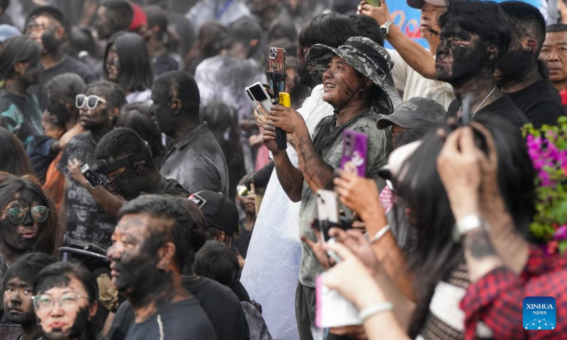 People take part in a folk event called 