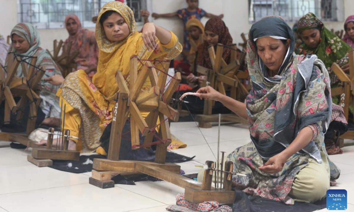 Workers spin cotton into thread to craft traditional muslin garments at a workshop in Narayanganj, Bangladesh, April 19, 2025. (Photo by Habibur Rahman/Xinhua)