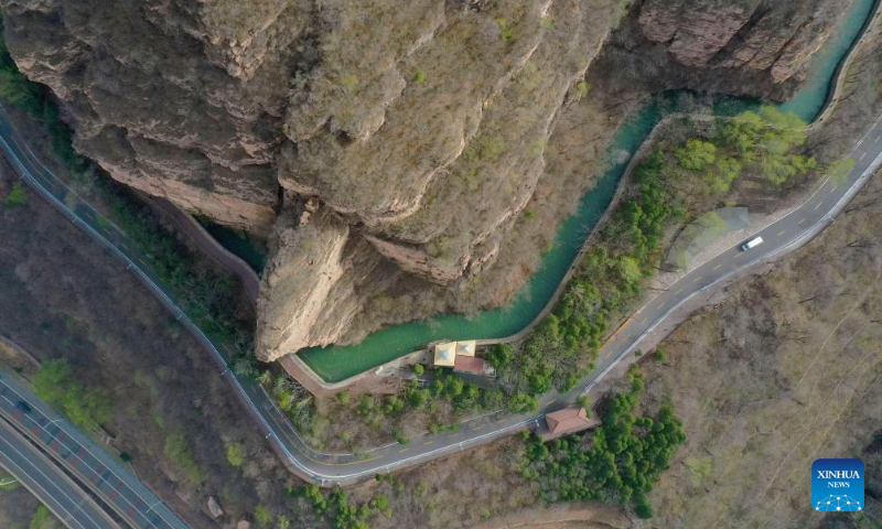 An aerial drone photo taken on March 25, 2025 shows a view of the main canal of the Hongqi Canal in Linzhou City, central China's Henan Province. The Hongqi Canal, an irrigation project built on the steep Taihang Mountains, is dubbed the 