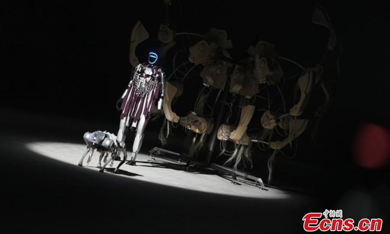 The humanoid robot G1, accompanied by a robotic dog, makes its debut at Shanghai Fashion Week, March 26, 2025. (Photo: China News Service)