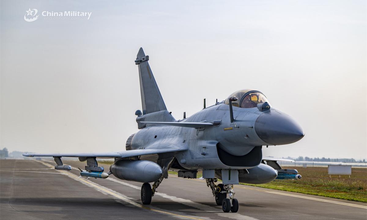 A J-10 fighter jet attached to a unit under the Chinese PLA Air Force taxies down the runway after completing the round-the-clock flight training exercise. (eng.chinamil.com.cn/Photo by Xiao Rui)