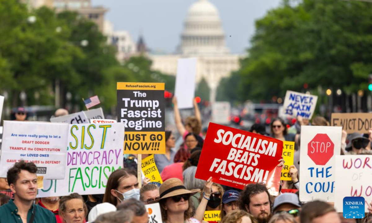 Demonstrators participate in a rally at Freedom Plaza in Washington, D.C., the United States, on May 1, 2025. (Xinhua/Hu Yousong)