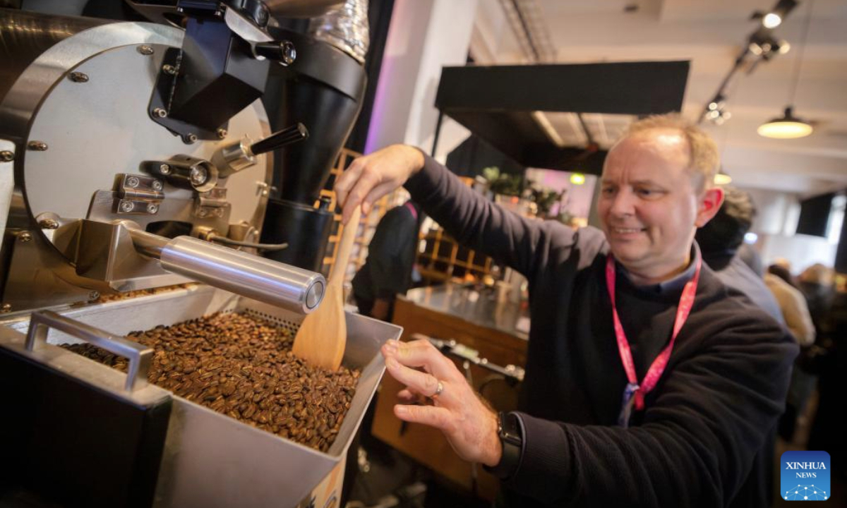An exhibitor roasts coffee beans during the 2025 Helsinki Coffee Festival in Helsinki, Finland, April 26, 2025. The 2025 Helsinki Coffee Festival is held here from April 25 to 27, featuring about 60 exhibitors showcasing their coffee products, tea beverages, coffee appliances and a variety of products. (Photo by Matti Matikainen/Xinhua)