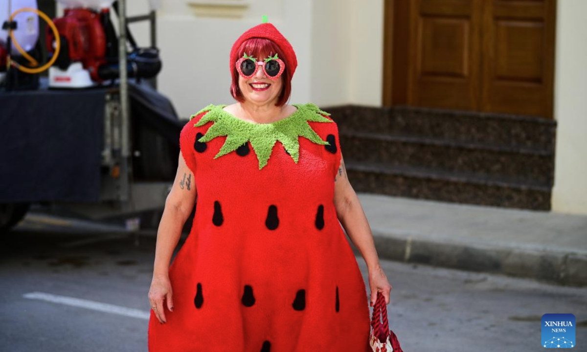 A woman wearing a strawberry costume is seen during the strawberry festival in Mgarr, Malta, April 27, 2025. Malta held its annual strawberry festival in Mgarr, a picturesque agricultural village in north Malta on Sunday. (Photo by Jonathan Borg/Xinhua)