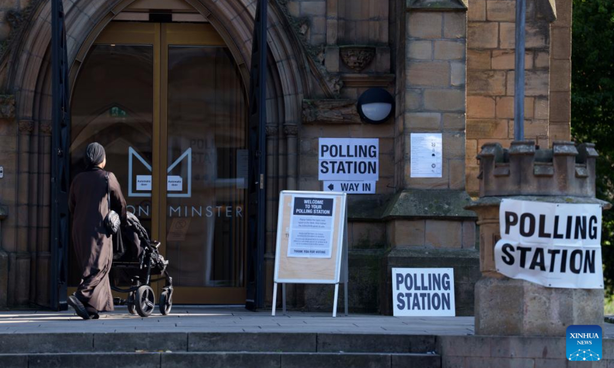 A woman heads to a polling station for local elections in Preston, Britain, May 1, 2025. Voters across England went to the polls on Thursday for local elections in the first major electoral test for political parties since the general election last year. More than 1,600 seats are being contested in councils across England. The elections also cover six mayoralties and a by-election in Runcorn and Helsby in Cheshire, the first since last year's general election. (Photo by Jon Super/Xinhua)
