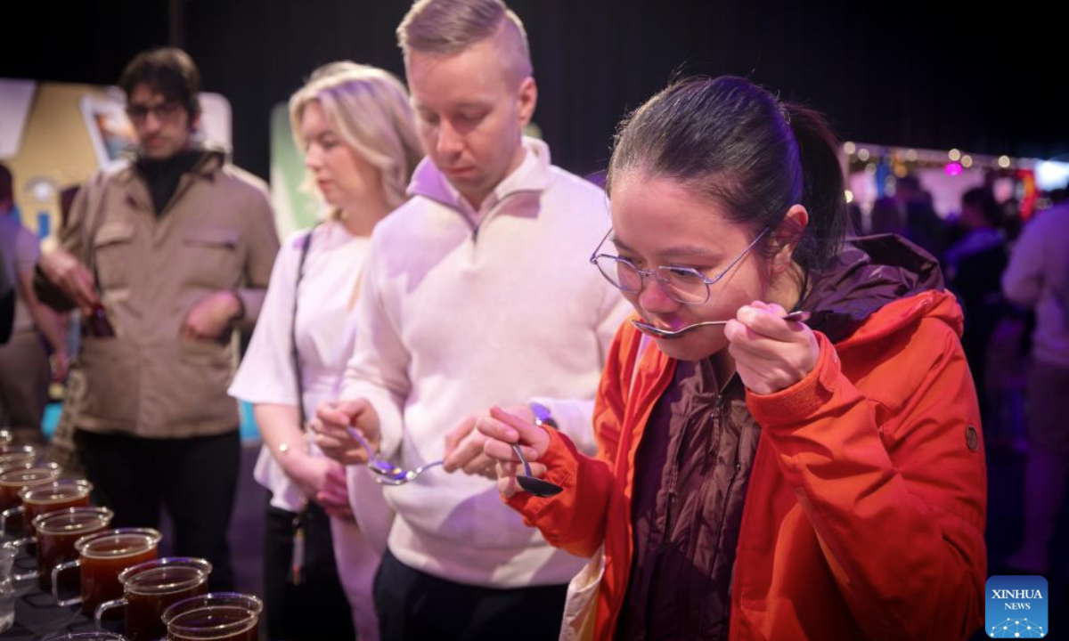 People taste coffee during the 2025 Helsinki Coffee Festival in Helsinki, Finland, April 26, 2025. The 2025 Helsinki Coffee Festival is held here from April 25 to 27, featuring about 60 exhibitors showcasing their coffee products, tea beverages, coffee appliances and a variety of products. (Photo by Matti Matikainen/Xinhua)