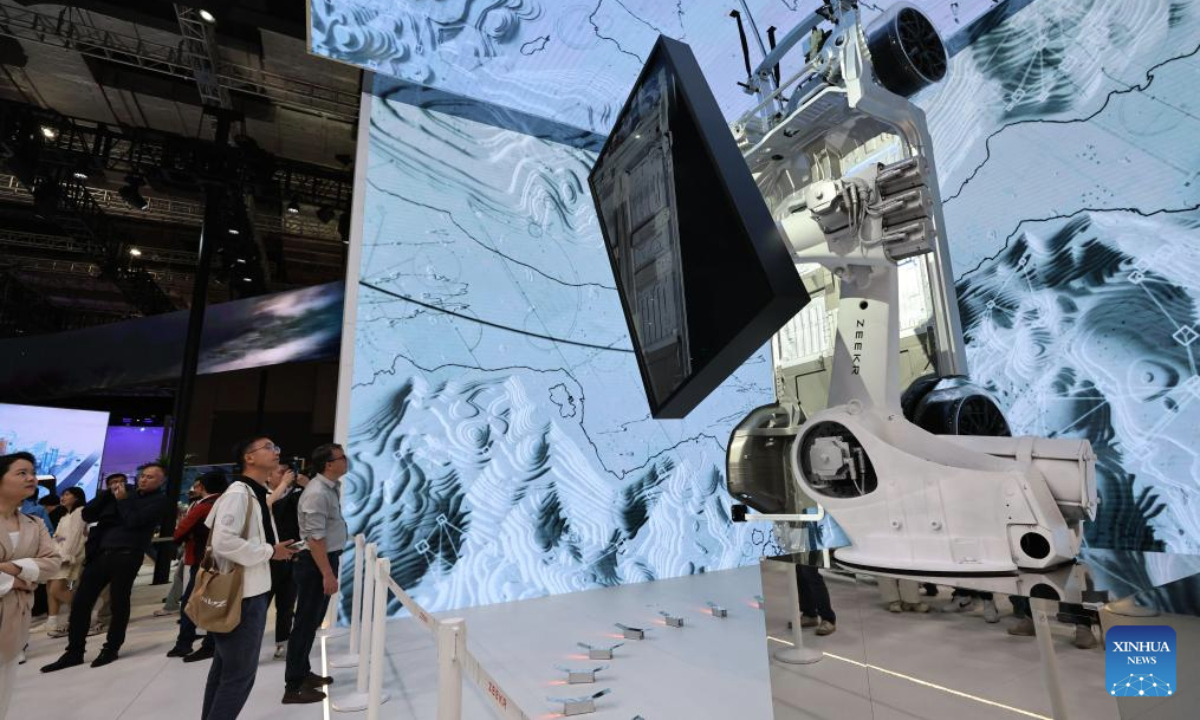 Visitors look at an exhibit of Chinese car brand Zeekr at the 21st Shanghai International Automobile Industry Exhibition in east China's Shanghai, April 26, 2025. The exhibition, also known as Auto Shanghai 2025, not only foreshadows technological trends in the global auto market, but also demonstrates the strength and confidence of China's rising automakers in the face of established global giants. (Xinhua/Fang Zhe)