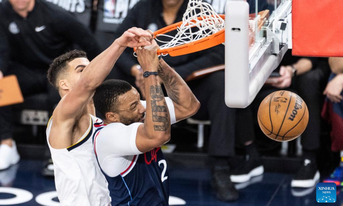 Los Angeles Clippers' Norman Powell (R) dunks during the 2024-2025 NBA first-round playoff basketball match between Los Angeles Clippers and Denver Nuggets in Los Angeles, the United States, May 1, 2025. (Photo by Ringo Chiu/Xinhua)
