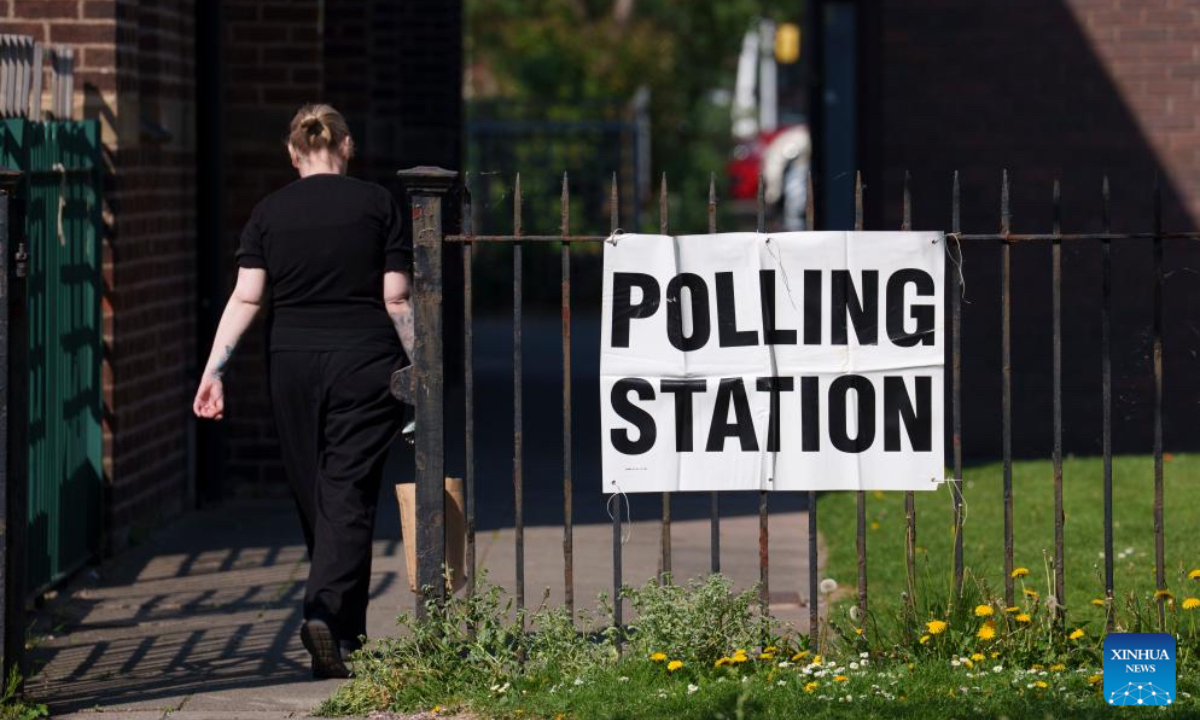 A woman heads to a polling station for local elections in Preston, Britain, May 1, 2025. Voters across England went to the polls on Thursday for local elections in the first major electoral test for political parties since the general election last year. More than 1,600 seats are being contested in councils across England. The elections also cover six mayoralties and a by-election in Runcorn and Helsby in Cheshire, the first since last year's general election. (Photo by Jon Super/Xinhua)
