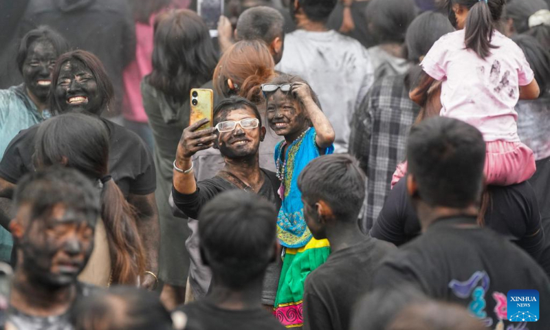 People take part in a folk event called 