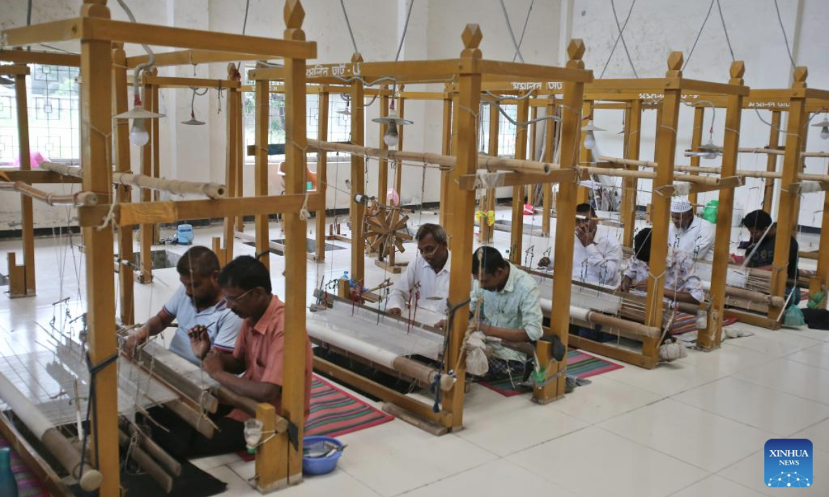 Workers craft traditional muslin garments at a workshop in Narayanganj, Bangladesh, April 19, 2025. (Photo by Habibur Rahman/Xinhua)
