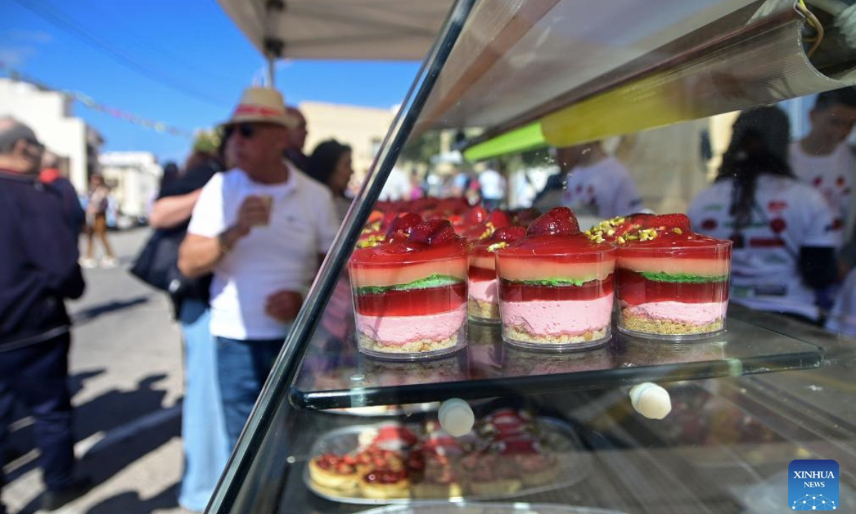 People buy cakes made with strawberries during the strawberry festival in Mgarr, Malta, April 27, 2025. Malta held its annual strawberry festival in Mgarr, a picturesque agricultural village in north Malta on Sunday. (Photo by Jonathan Borg/Xinhua)