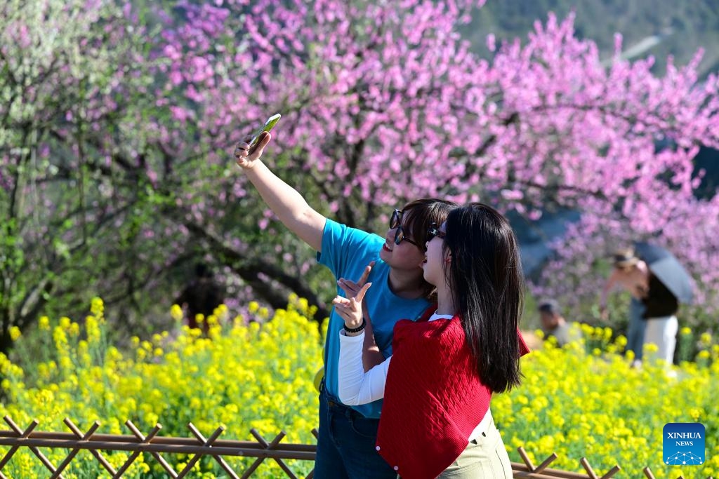 Visitors take a selfie at Shitan Village in Shexian County, Huangshan City of east China's Anhui Province, March 25, 2025. (Photo: Xinhua)