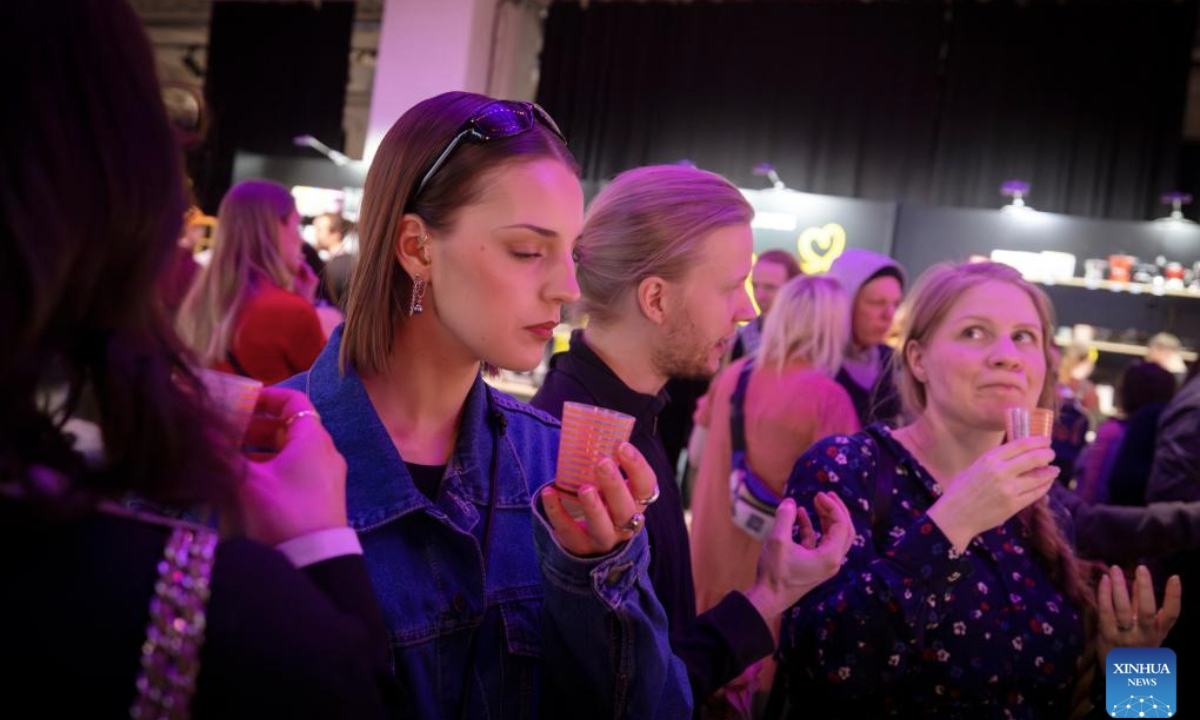 People taste coffee during the 2025 Helsinki Coffee Festival in Helsinki, Finland, April 26, 2025. The 2025 Helsinki Coffee Festival is held here from April 25 to 27, featuring about 60 exhibitors showcasing their coffee products, tea beverages, coffee appliances and a variety of products. (Photo by Matti Matikainen/Xinhua)