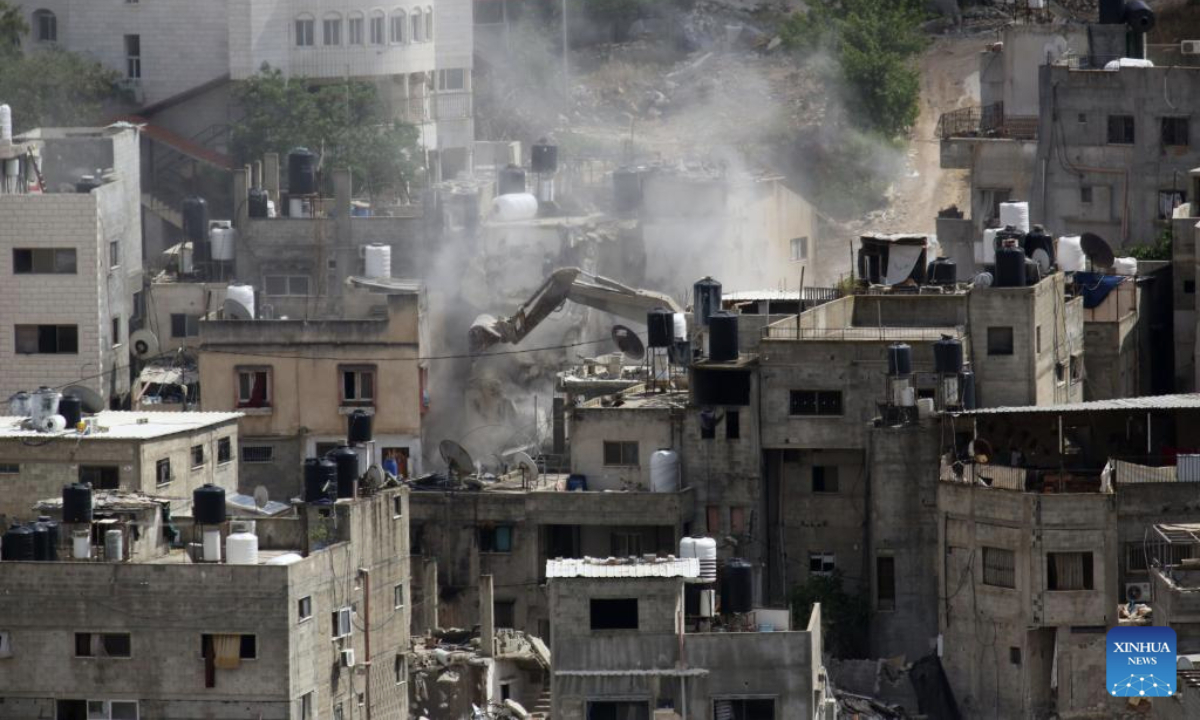 An Israeli excavator demolishes a Palestinian house in the Nur Shams refugee camp, east of Tulkarm, northern West Bank, on May 5, 2025. (Photo by Nidal Eshtayeh/Xinhua)
