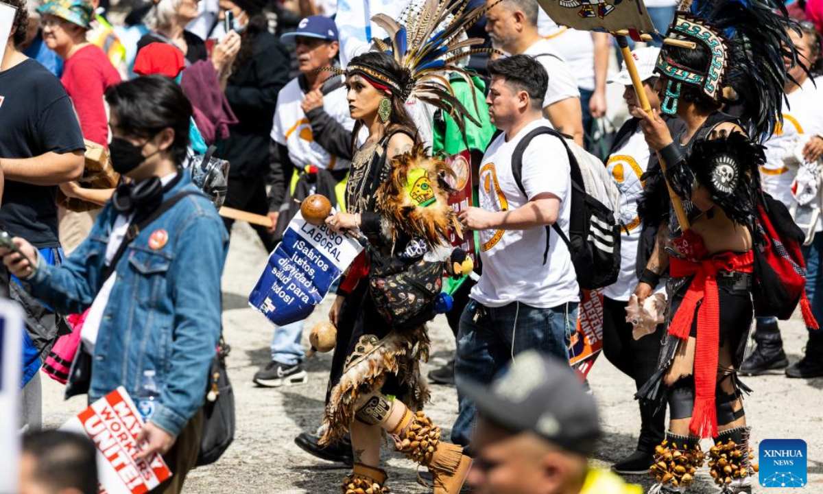 Demonstrators march during a rally at Grant Park in Chicago, the United States, on May 1, 2025. (Photo by Vincent D. Johnson/Xinhua)