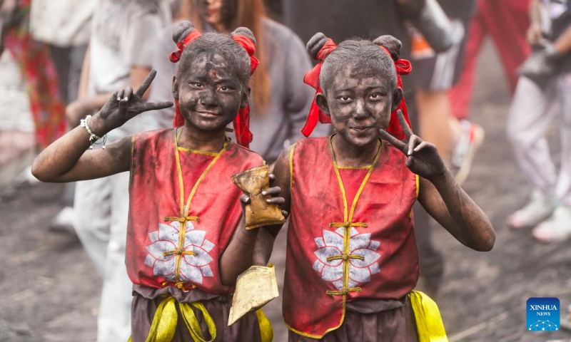 People take part in a folk event called 