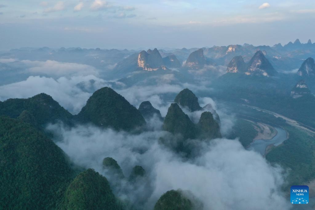 An aerial drone photo taken on Aug. 25, 2022 shows a view of mountains along the Lijiang River in Guilin, south China's Guangxi Zhuang Autonomous Region. Guilin, renowned for its breathtaking karst landscape, is one of China's most iconic destinations. Nestled in the Guangxi Zhuang Autonomous Region, Guilin is celebrated for its stunning natural beauty, with limestone peaks and serene rivers that attract visitors from around the world. Its unique topography and vibrant culture make it a cornerstone of Chinese tourism. (Photo: Xinhua)