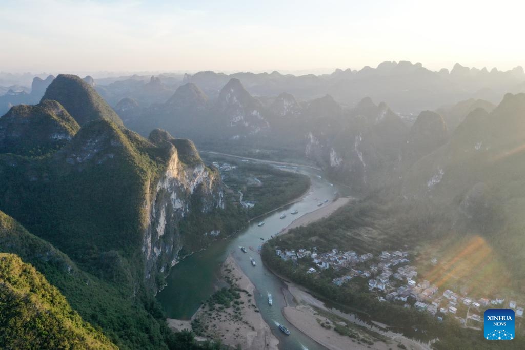 An aerial drone photo taken on Oct. 24, 2024 shows a view along the Lijiang River in Guilin, south China's Guangxi Zhuang Autonomous Region. Guilin, renowned for its breathtaking karst landscape, is one of China's most iconic destinations. Nestled in the Guangxi Zhuang Autonomous Region, Guilin is celebrated for its stunning natural beauty, with limestone peaks and serene rivers that attract visitors from around the world. Its unique topography and vibrant culture make it a cornerstone of Chinese tourism. (Photo: Xinhua)
