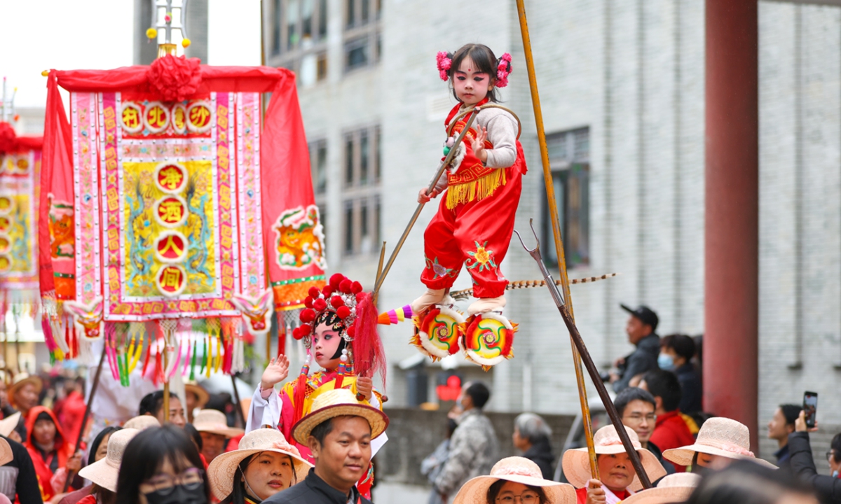 People participate in the Shawan Piaose parade in Panyu, South China's Guangdong Province, on March 31, 2025. The parade is a traditional folk art in the Lingnan region that combines drama, magic, acrobatics, music and dance, and traditionally takes place annually on the third day of the third month of the traditional Chinese calendar. Photo: VCG