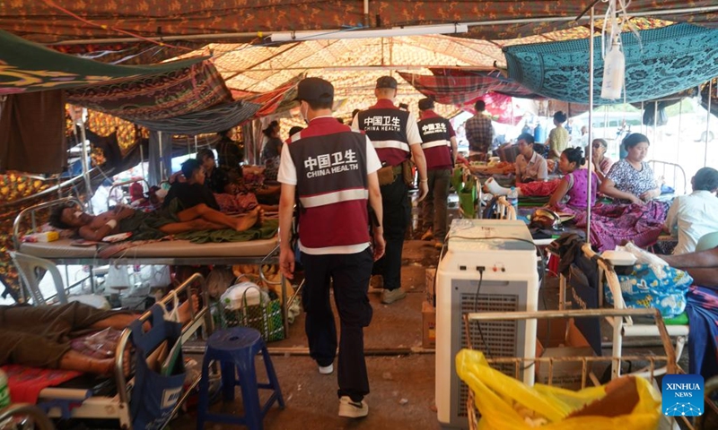 Experts of a rescue and medical team from China's Yunnan Province check the patients at a hospital in Nay Pyi Taw, Myanmar, March 31, 2025. (Photo: Xinhua)