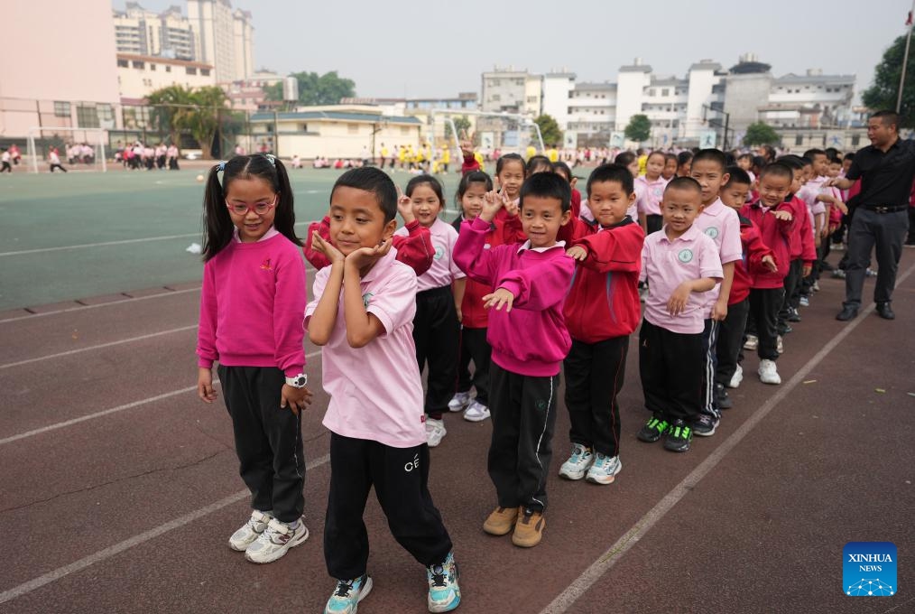 Pupils line up to play games on the playground at a primary school in Ruili, southwest China's Yunnan Province, March 31, 2025. (Photo: Xinhua)