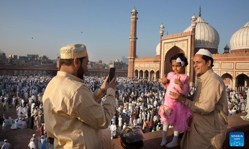 A girl poses for photos while attending Eid al-Fitr prayers at Jama Masjid (grand mosque) in New Delhi, India, March 31, 2025. (Photo: Xinhua)