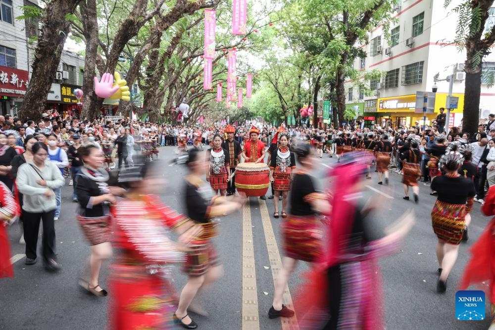 People dance during a Sanyuesan celebration in Wuzhishan City of south China's Hainan Province, March 31, 2025. Local people held various events in Wuzhishan to celebrate the Sanyuesan Festival which falls on the third day of the third lunar month. (Photo: Xinhua)