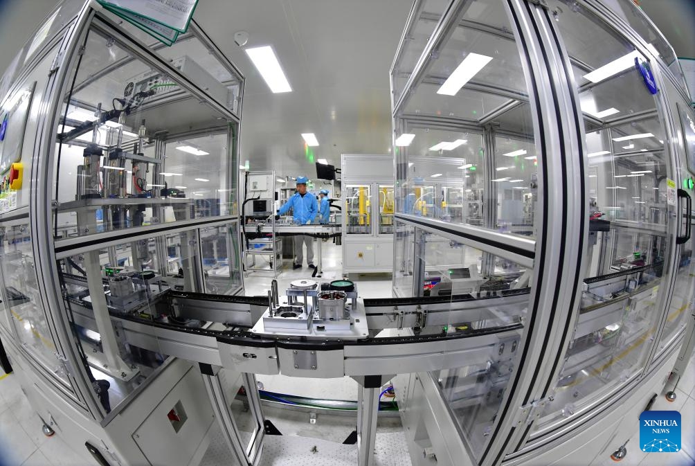 Technicians work on a production line of electric oil pumps at a workshop of Hengxin Powertrain Technology Co., Ltd. in Feixi County of Hefei, east China's Anhui Province, March 31, 2025. In recent years, Feixi County has fostered the cluster development of emerging industries including new energy and intelligent connected vehicles, integrated circuits, advanced photovoltaic and energy storage, biomedicine, low-altitude economy, etc. to inject momentum into the county's high-quality economic development. (Photo: Xinhua)